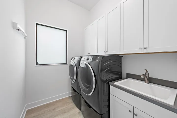 Laundry Room with Storage Cabinetry & Laundry Sink