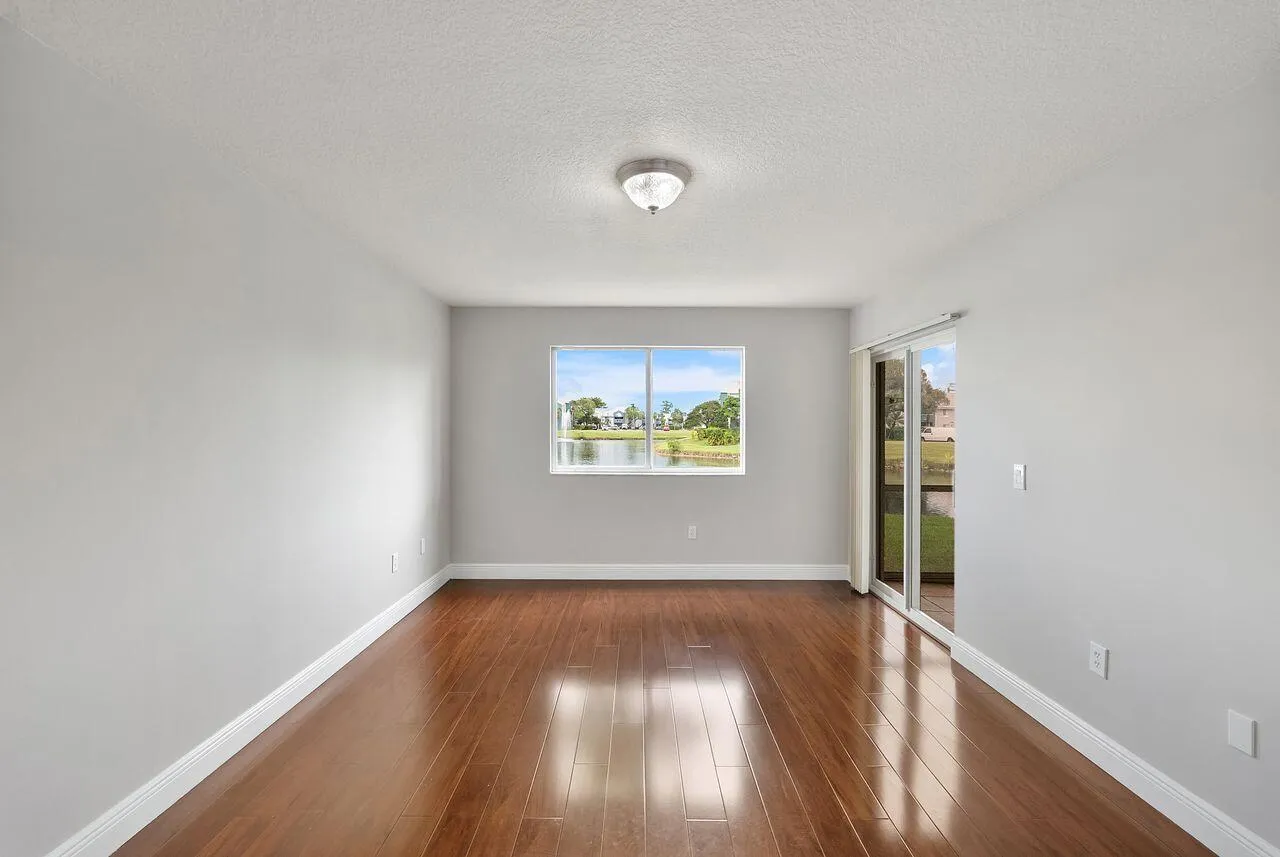 Primary Bedroom with access to back screened and enclosed patio