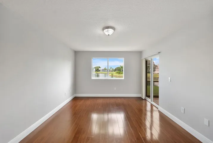 Primary Bedroom with access to back screened and enclosed patio