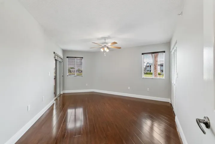 2nd bedroom with access to screened and enclosed patio
