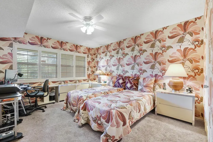2nd large bedroom. Unique fabric wallpaper.