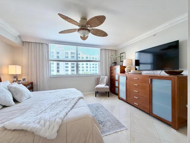 King size bed, wall mounted TV, marble floors