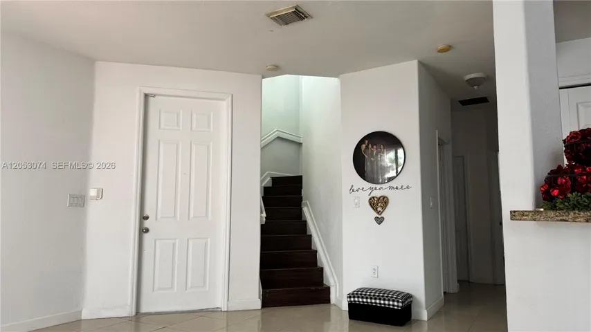 Stairs to Second Floor and main entrance