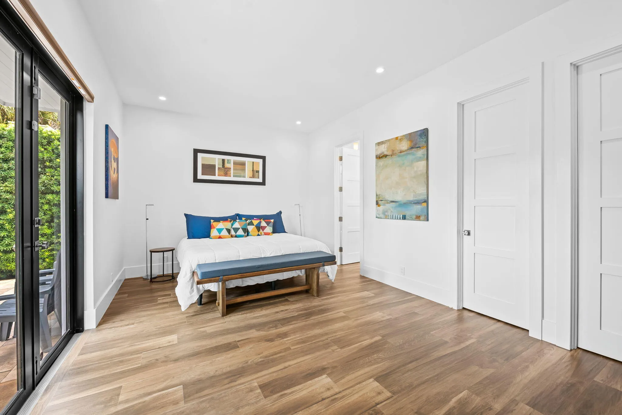 Primary bedroom leading out to the pool
