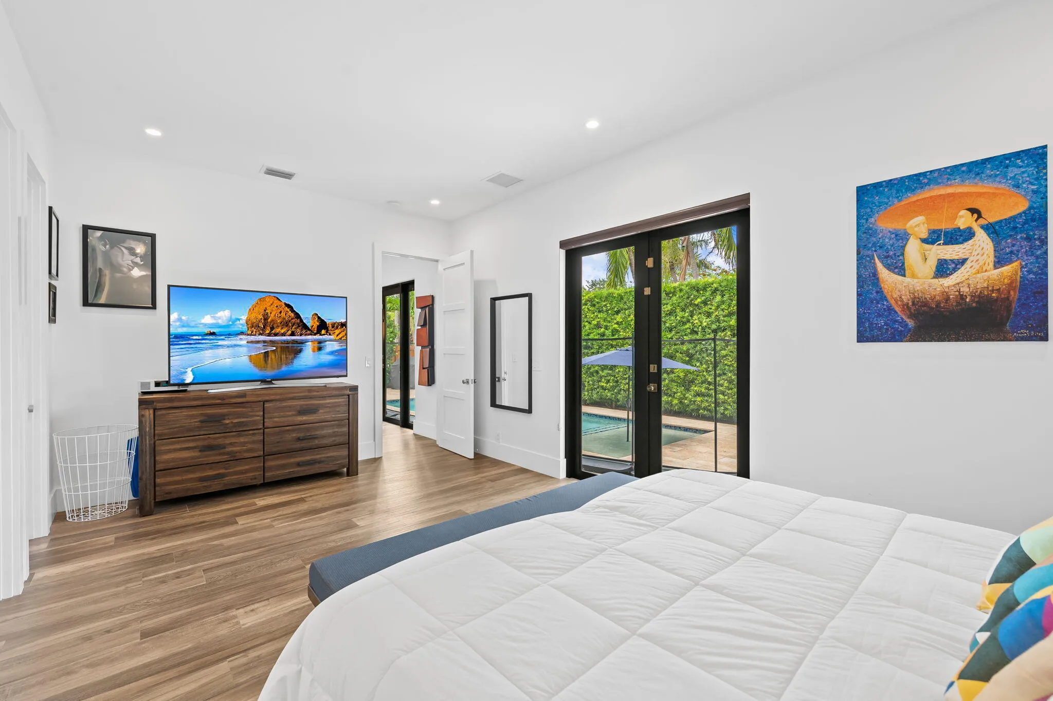 Primary bedroom leading out to the pool