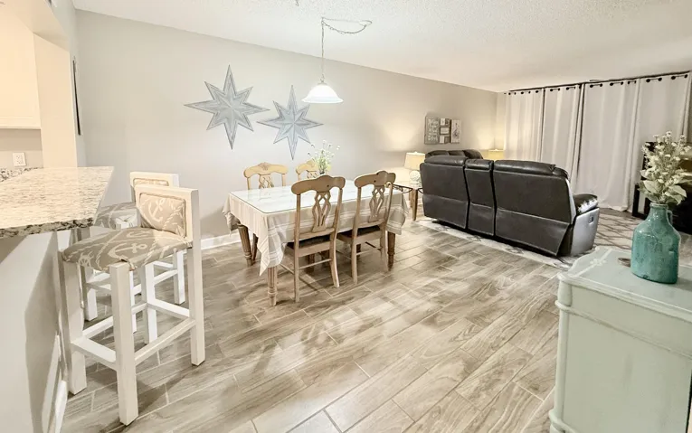 Bar seating, formal dining, open concept living.