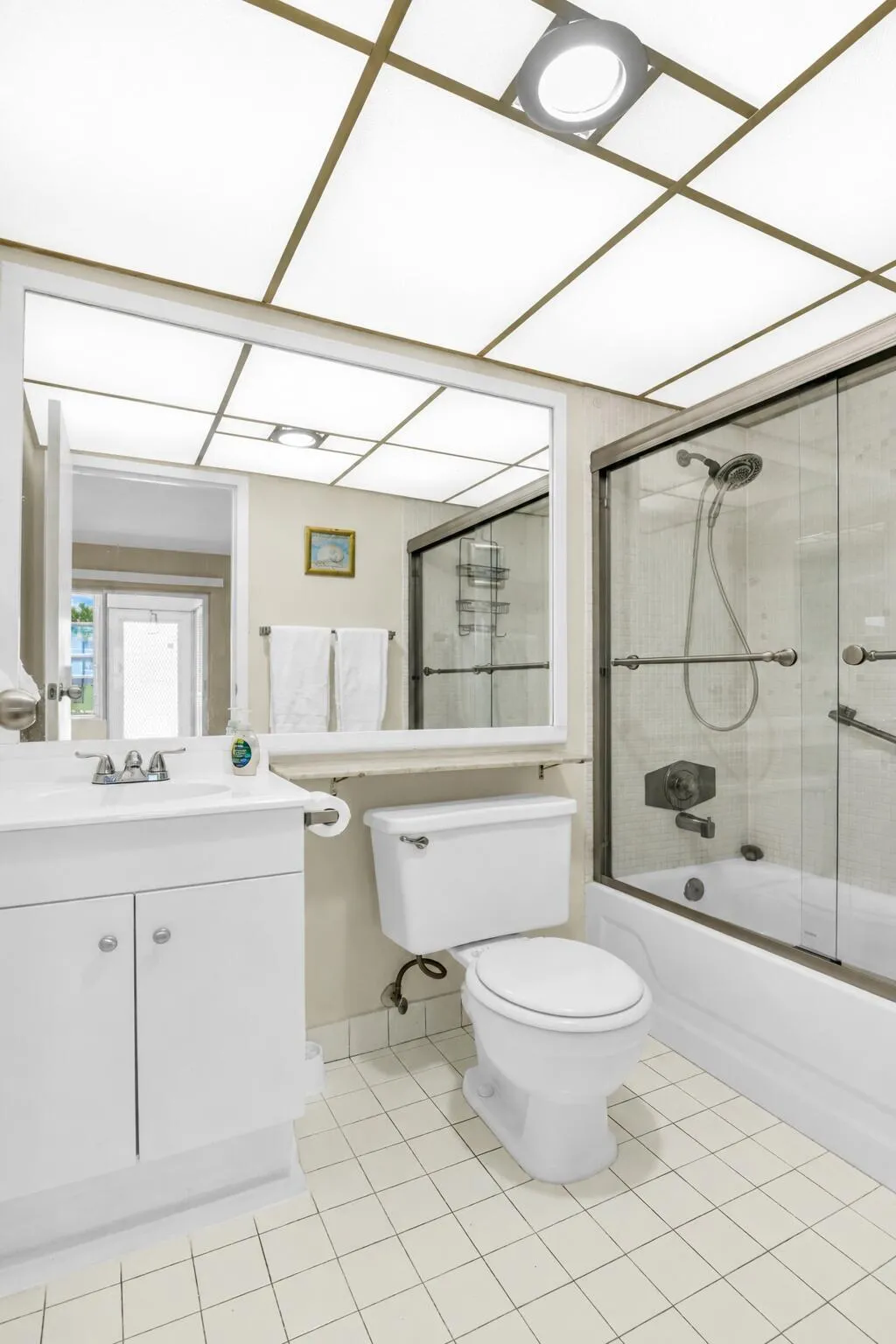 Dedicated laundry closet featuring a top-load washer and front-load dryer