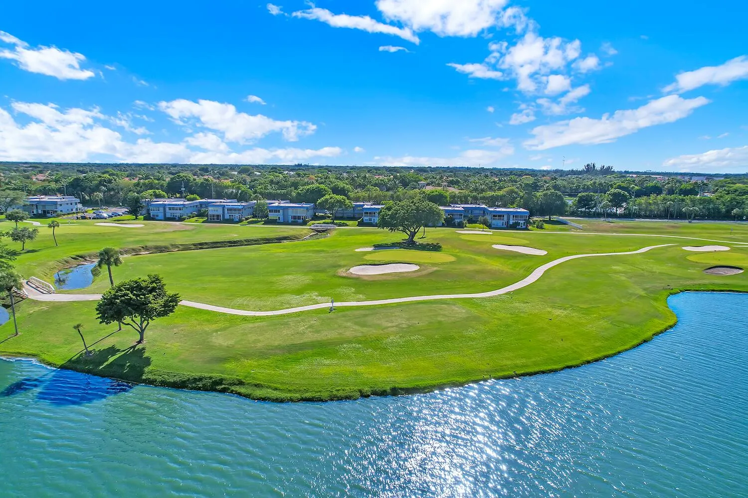 Expansive golf course with manicured greens and sand traps