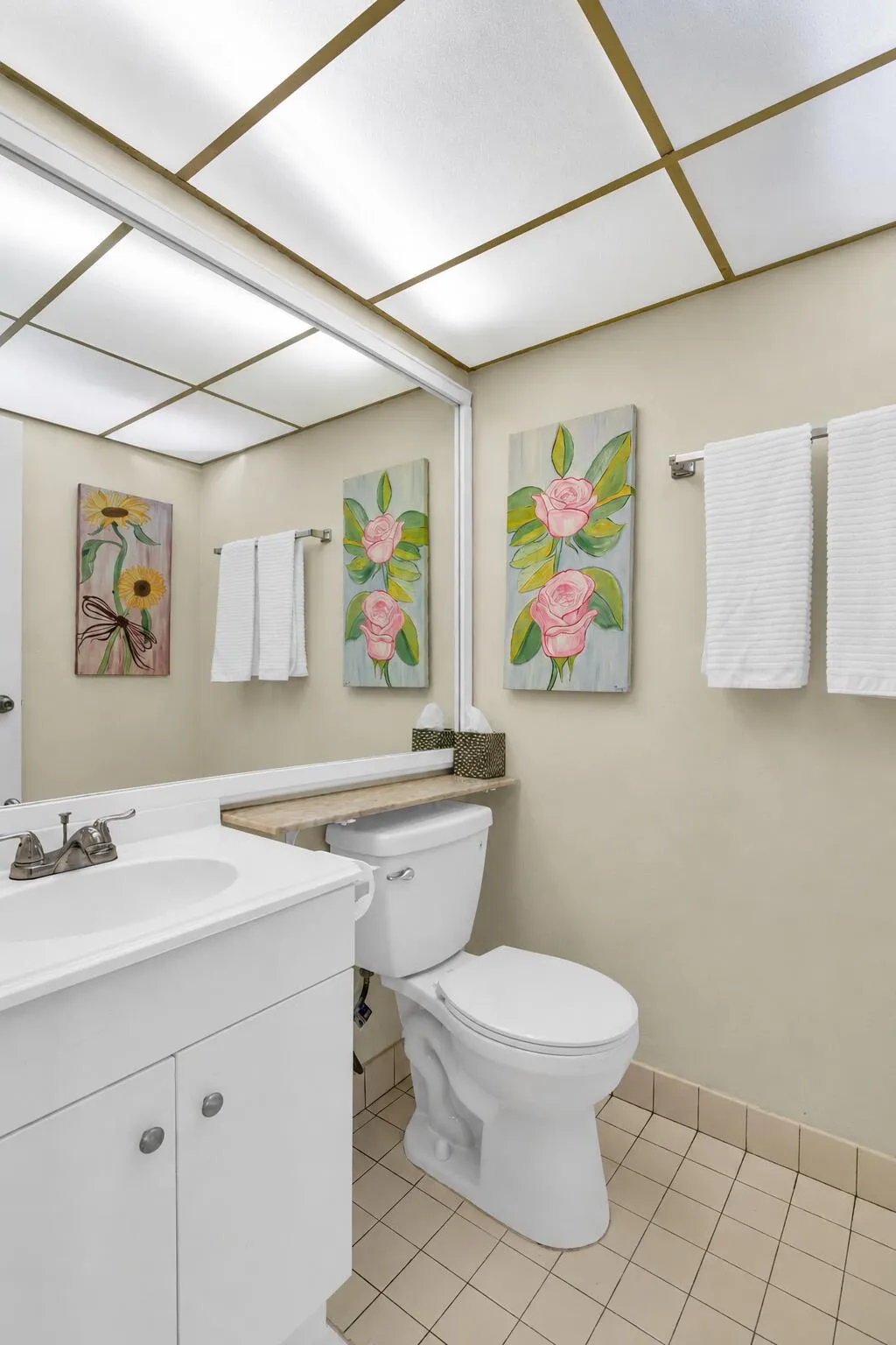 Bathroom featuring a large vanity with white cabinetry, a rectangular sink, and chrome fixtures