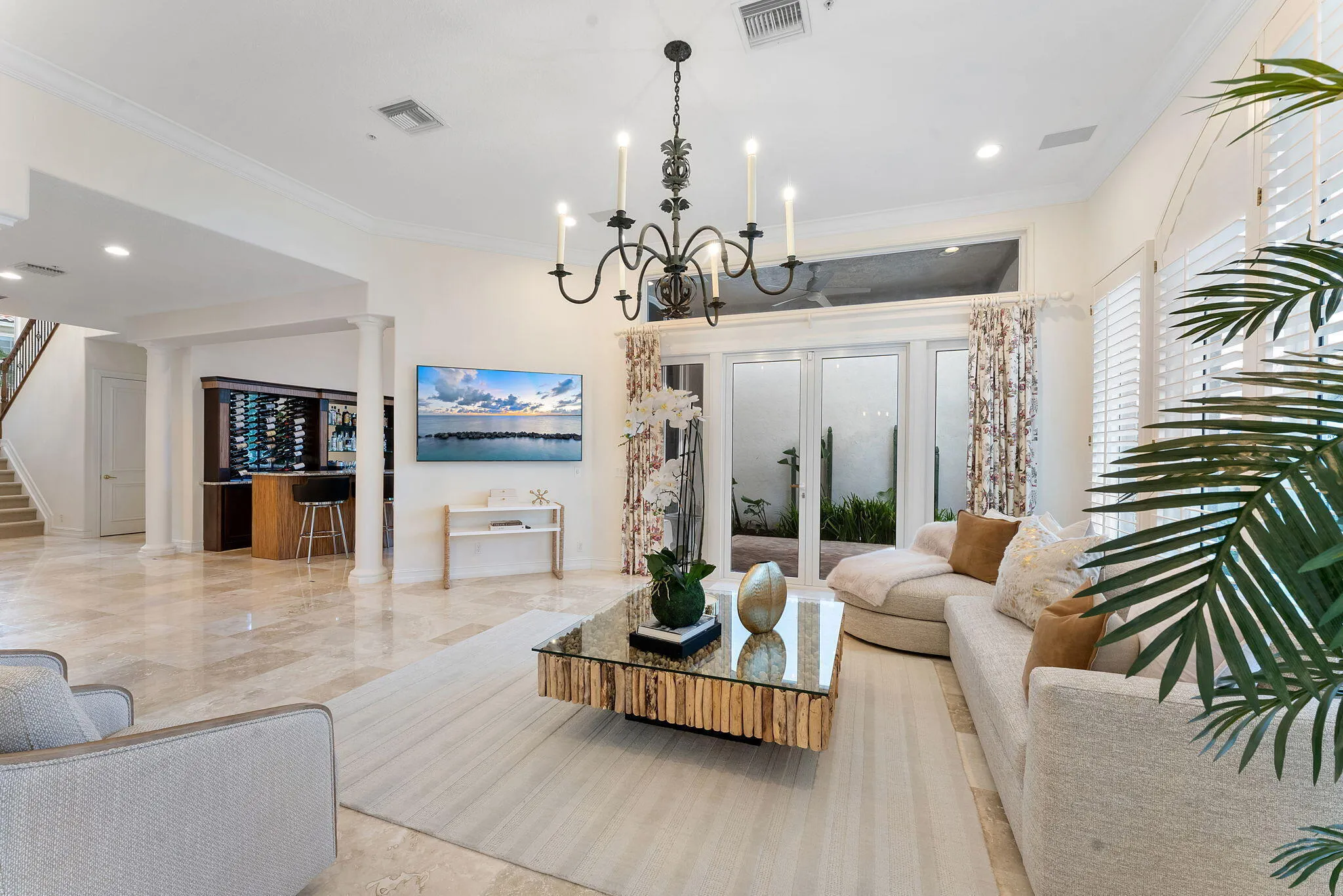 Living room flows seemlessly into the bar, the dining room and the kitchen.
