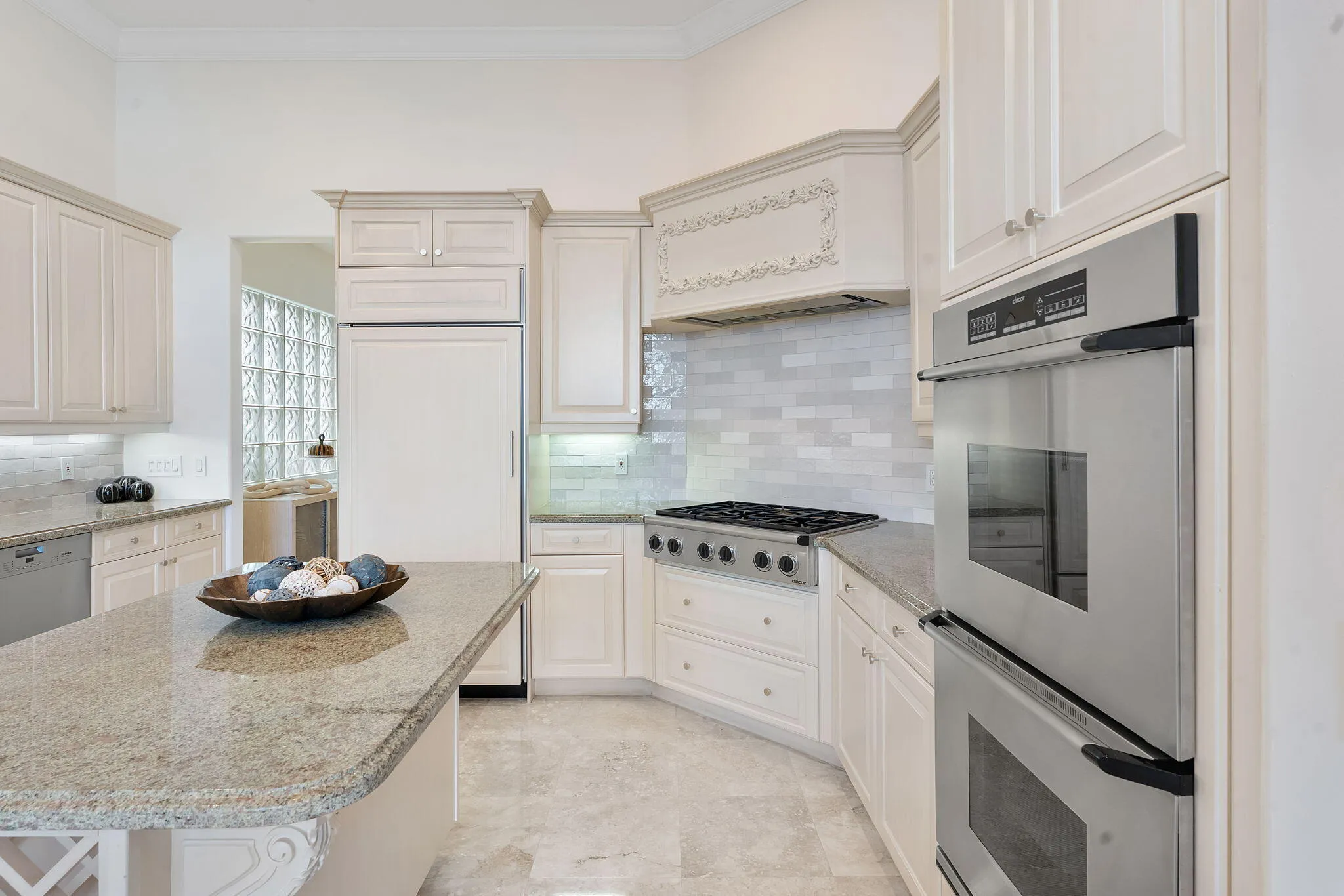 Kitchen with dual wall oven and gas range.
