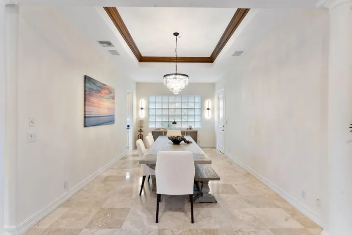 Dining room with soaring ceilings and ample natural light.