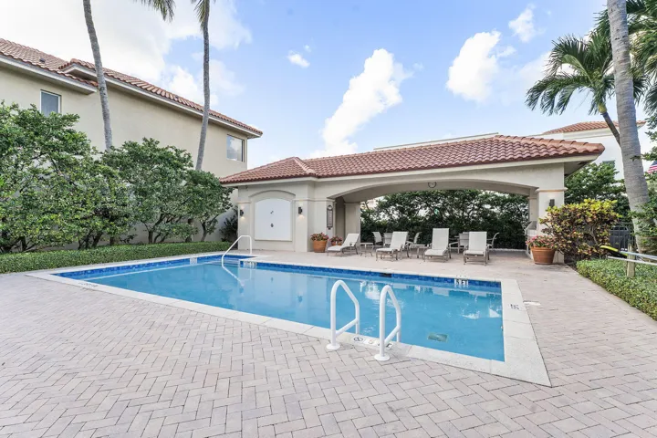 Heated/chilled pool with summer kitchen, outdoor shower and restrooms. Directly across the street from the beach.