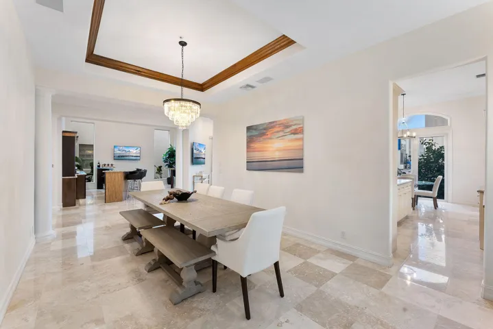 Dining room with soaring ceilings and ample natural light.