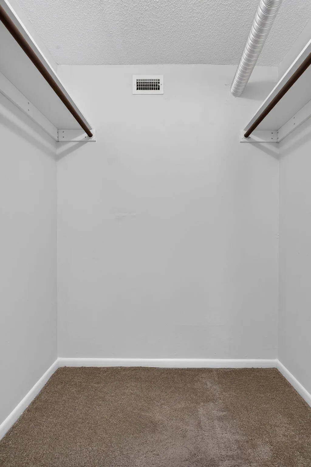 Walk-In Closet in Primary Bedroom