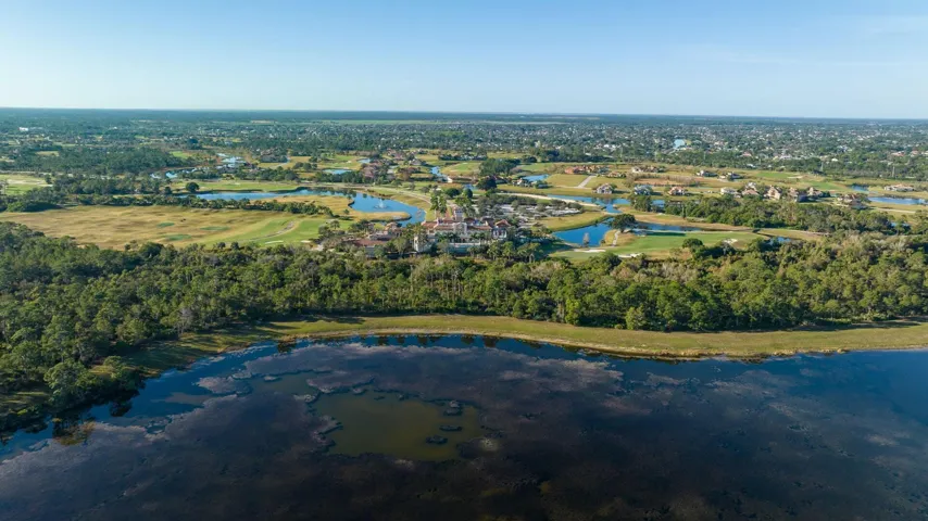 tesoro-club-pg-clubhouse-aerial-lake-032