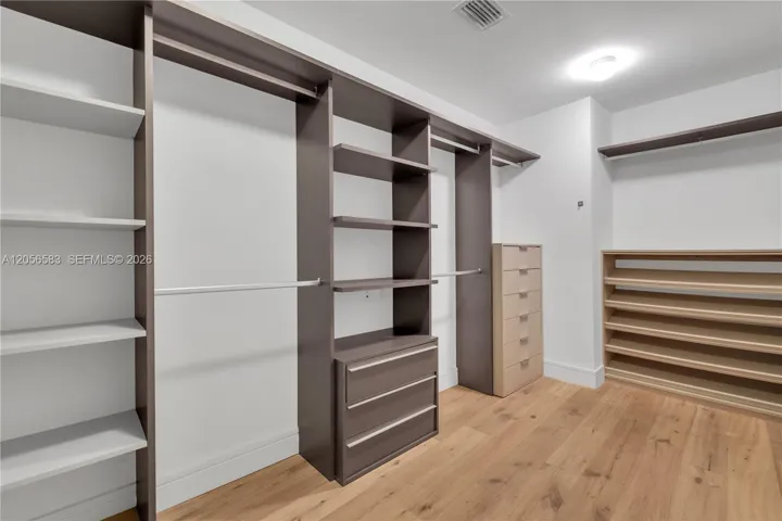 Elegant and spacious Master Walking Closet