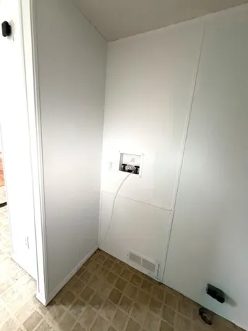 Stackable Washer and Dryer in Shed