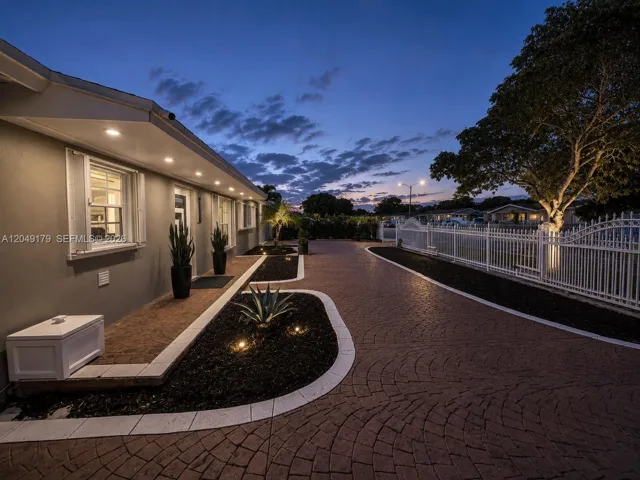 Designed for everyday convenience and entertaining, the expansive circular driveway provides parking for up to 7 vehicles with plenty of room for guests.