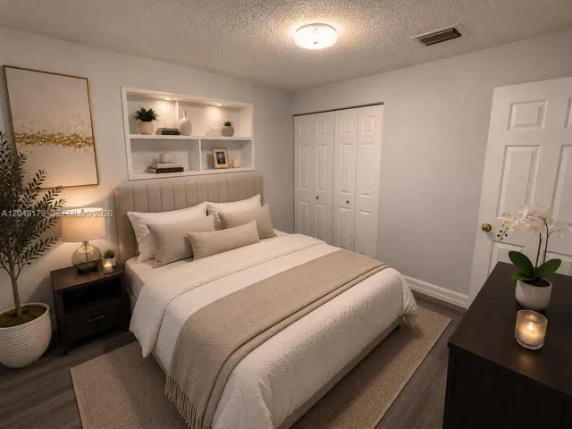 Bright and inviting secondary bedroom featuring a spacious closet and a versatile layout to accommodate family, guests, or a home office.