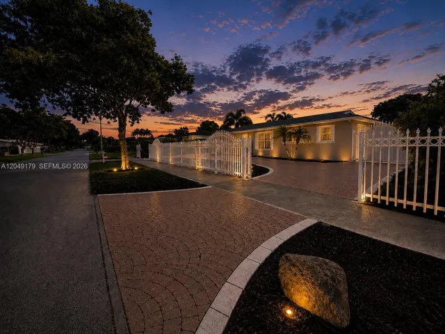 Set back from the street with an inviting approach, the home offers a sense of space, privacy, and everyday comfort before you even step inside.