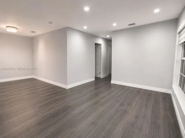 Expansive open-concept living area offering exceptional flexibility for relaxing, entertaining, and everyday living.