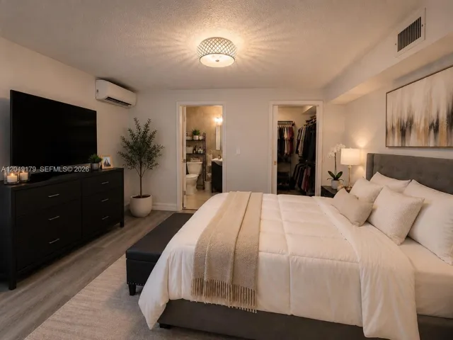 Spacious primary suite featuring a walk-in closet and private en-suite bath, creating a comfortable retreat at the end of the day.