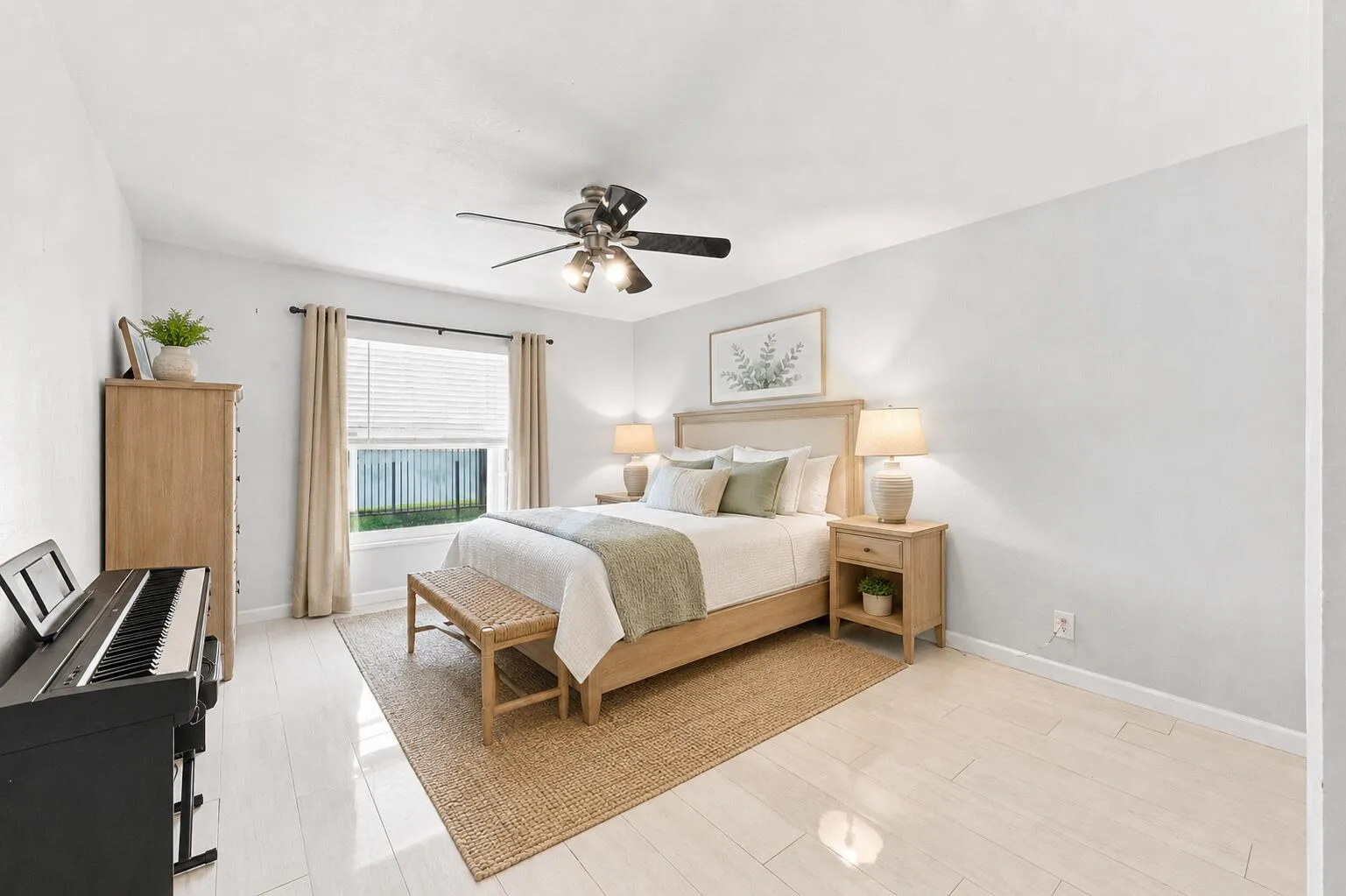 Bright interior room featuring light wood-finish flooring