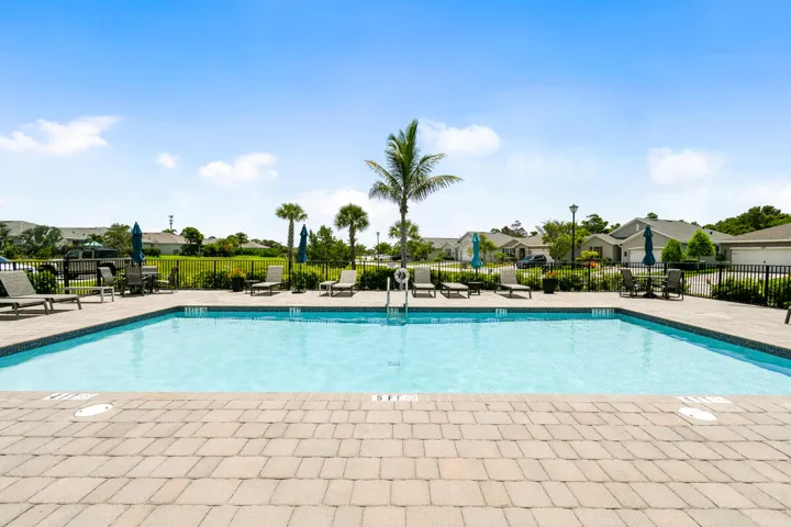 Community swimming pool with a paver deck surround