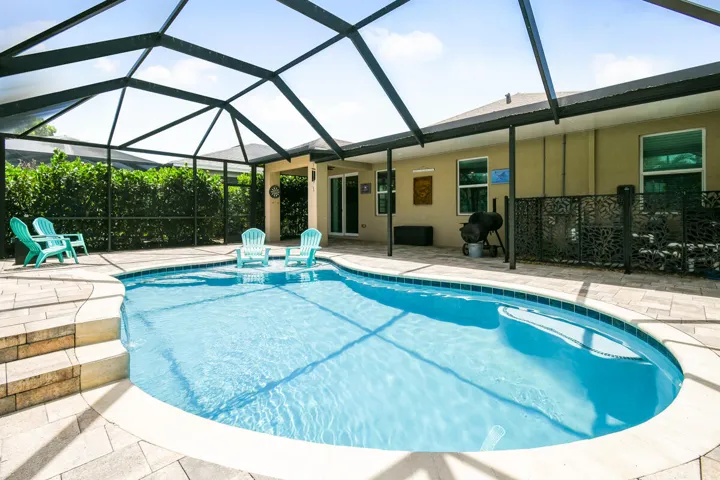 Covered Lanai offers seating/dining area, bbq space.