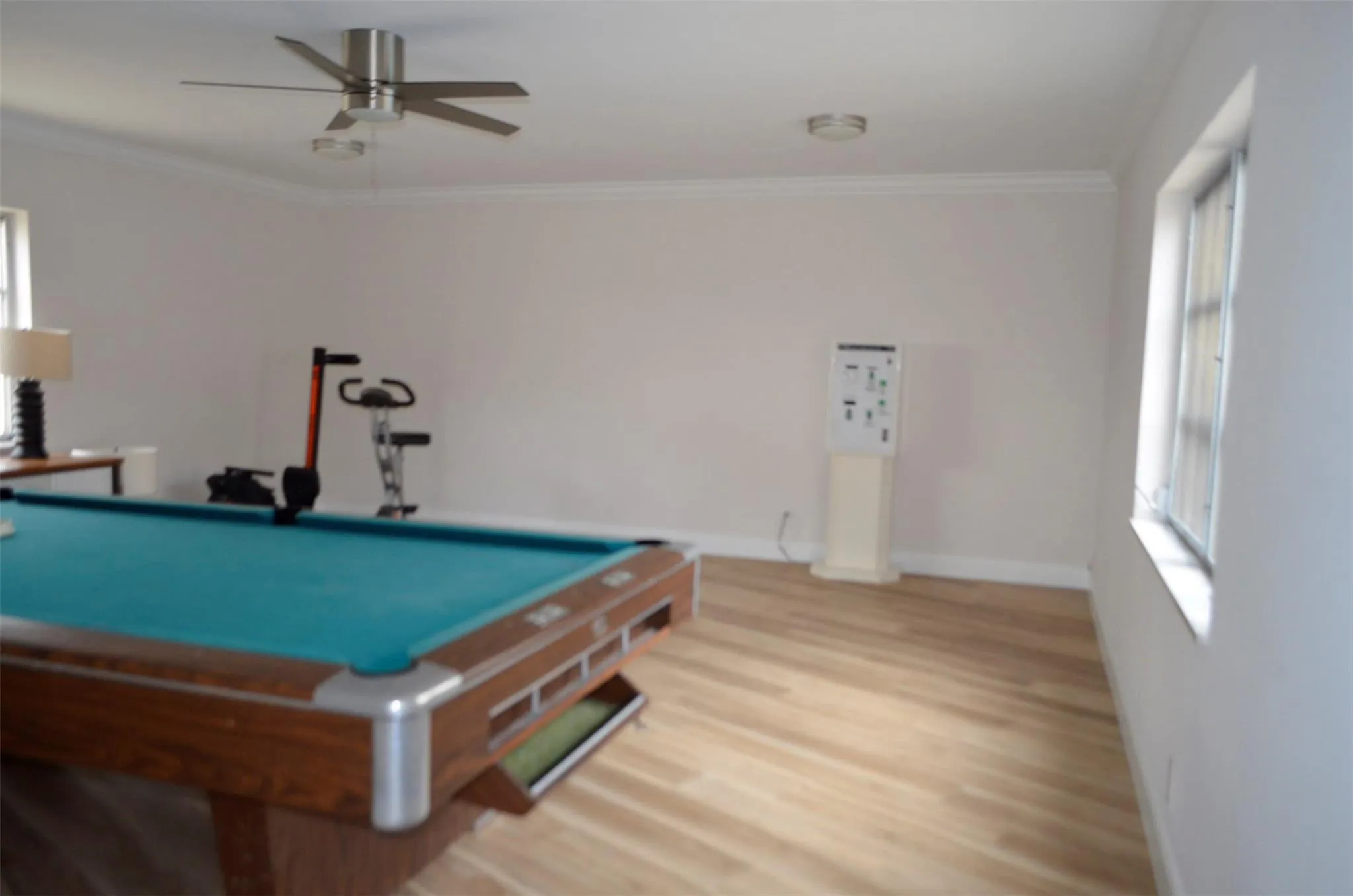 Clubhouse has a Game room, louge area, ceiling fan and wood-finishing flooring.