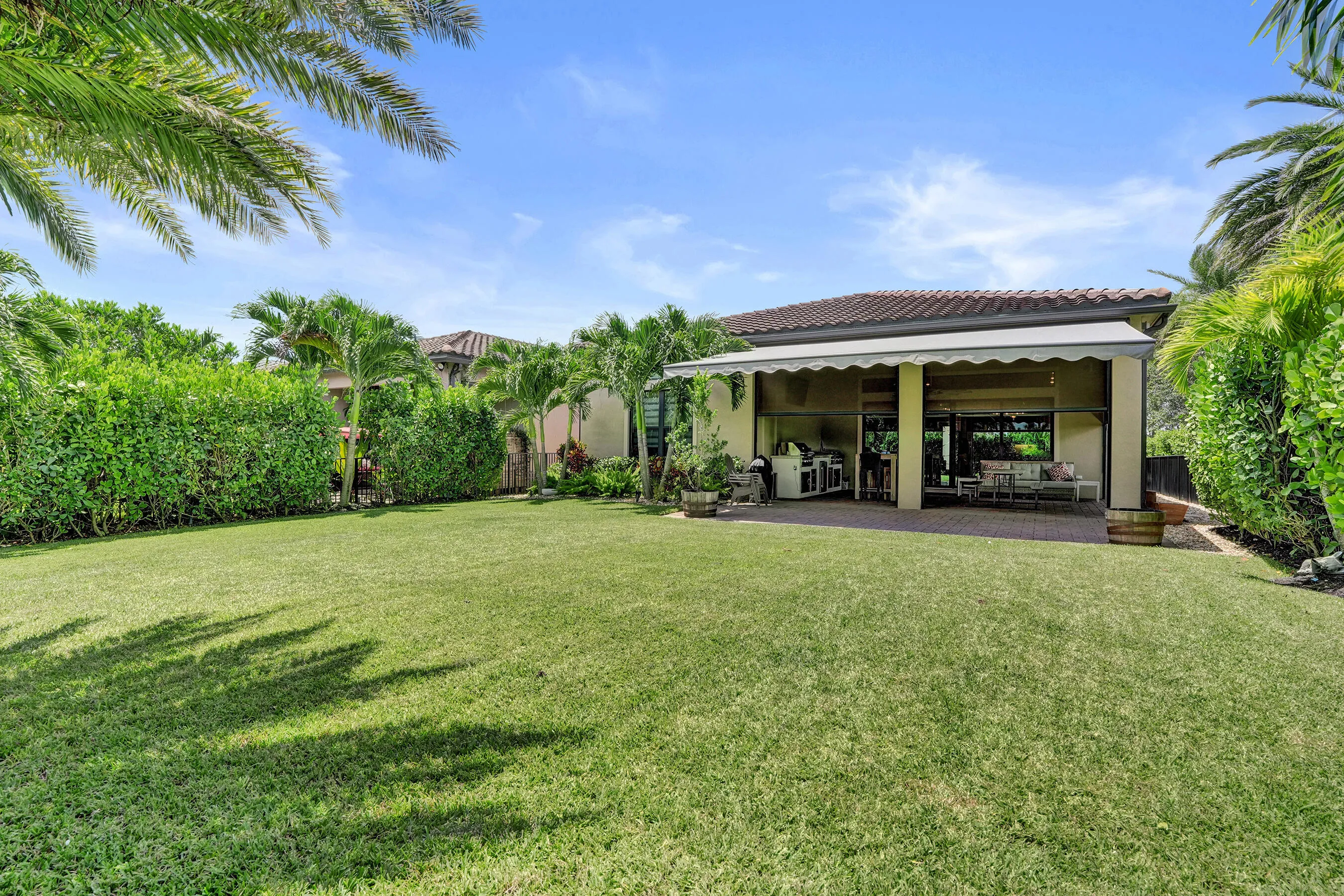 Fully fenced in yard with lush landscaping