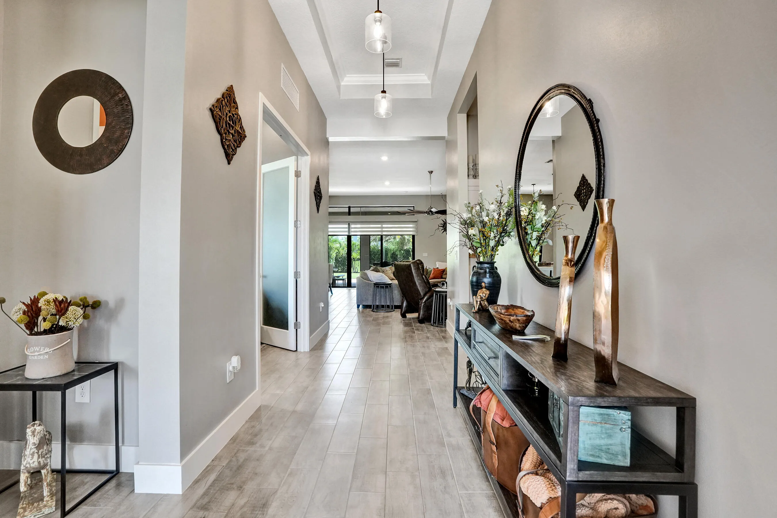 Welcome to this beautiful home featuring Ceramic plank flooring and 12+ ft ceilings, vaulted ceiling, totally upgraded thru out