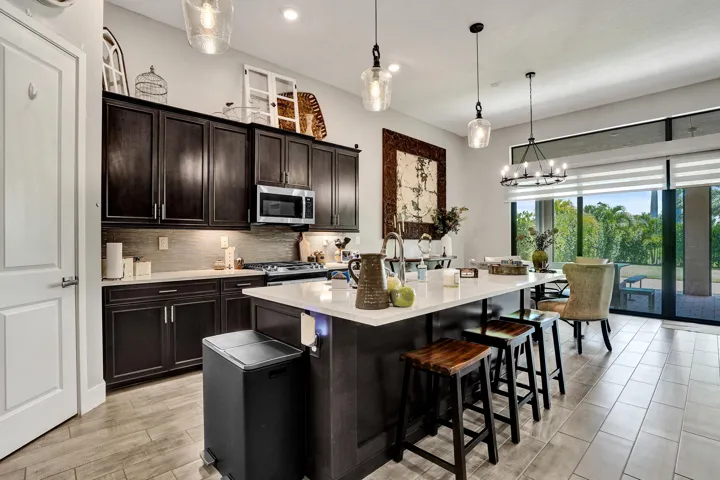 Kitchen opens up to the dining area and a 4 panel patio door