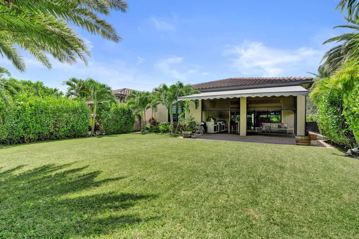Fully fenced in yard with lush landscaping