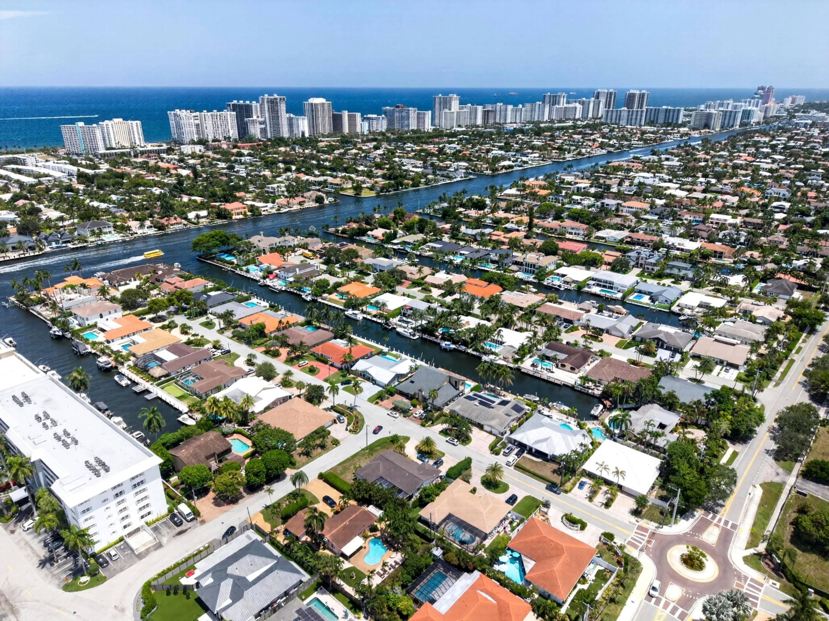 Aerial perspective showcasing a coastal community with multiple canals and ocean access