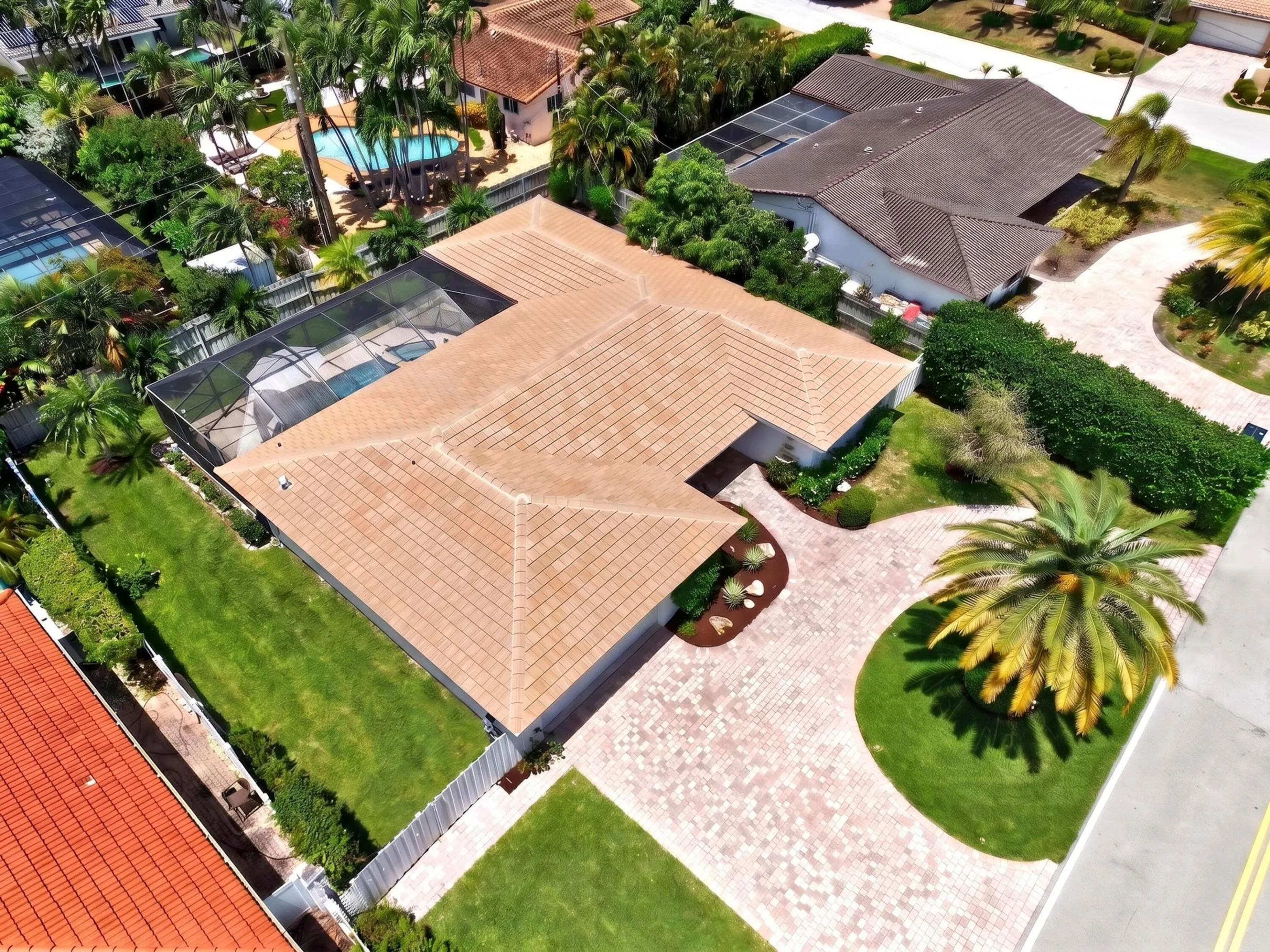 Tile roof residence with a screened-in swimming pool