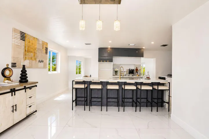 Spacious kitchen with ample cabinetry and generous counter space. Bright kitchen featuring abundant storage and functional layout. Well-appointed kitchen designed for everyday living and entertaining.