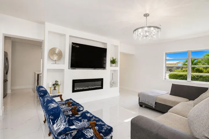 Spacious living room filled with natural light. Bright and inviting living area with an open, airy feel. Comfortable living room ideal for relaxing or entertaining.