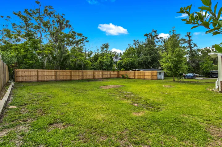 Large backyard, partially fenced