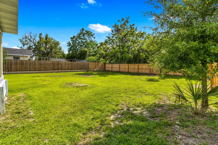 Large backyard, partially fenced