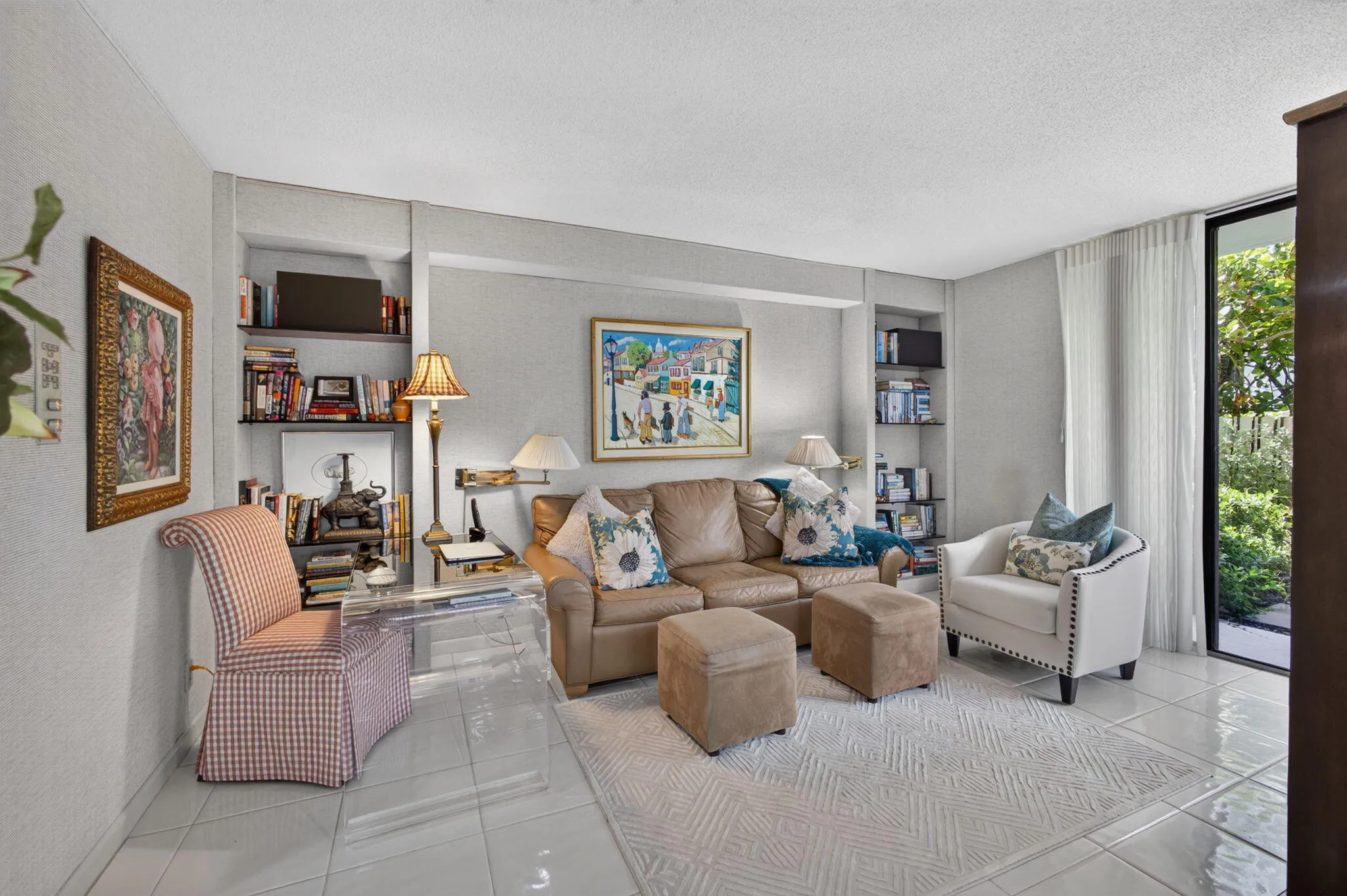 Bedroom 3 / Den area featuring tile flooring, built-in shelving, and a large glass door