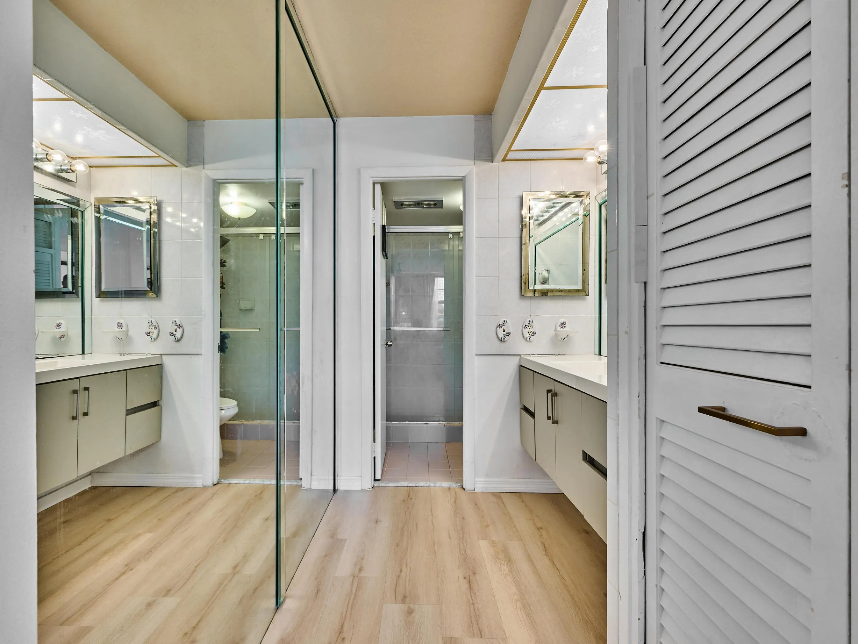 Primary Bathroom | Spacious vanity and glass-enclosed shower