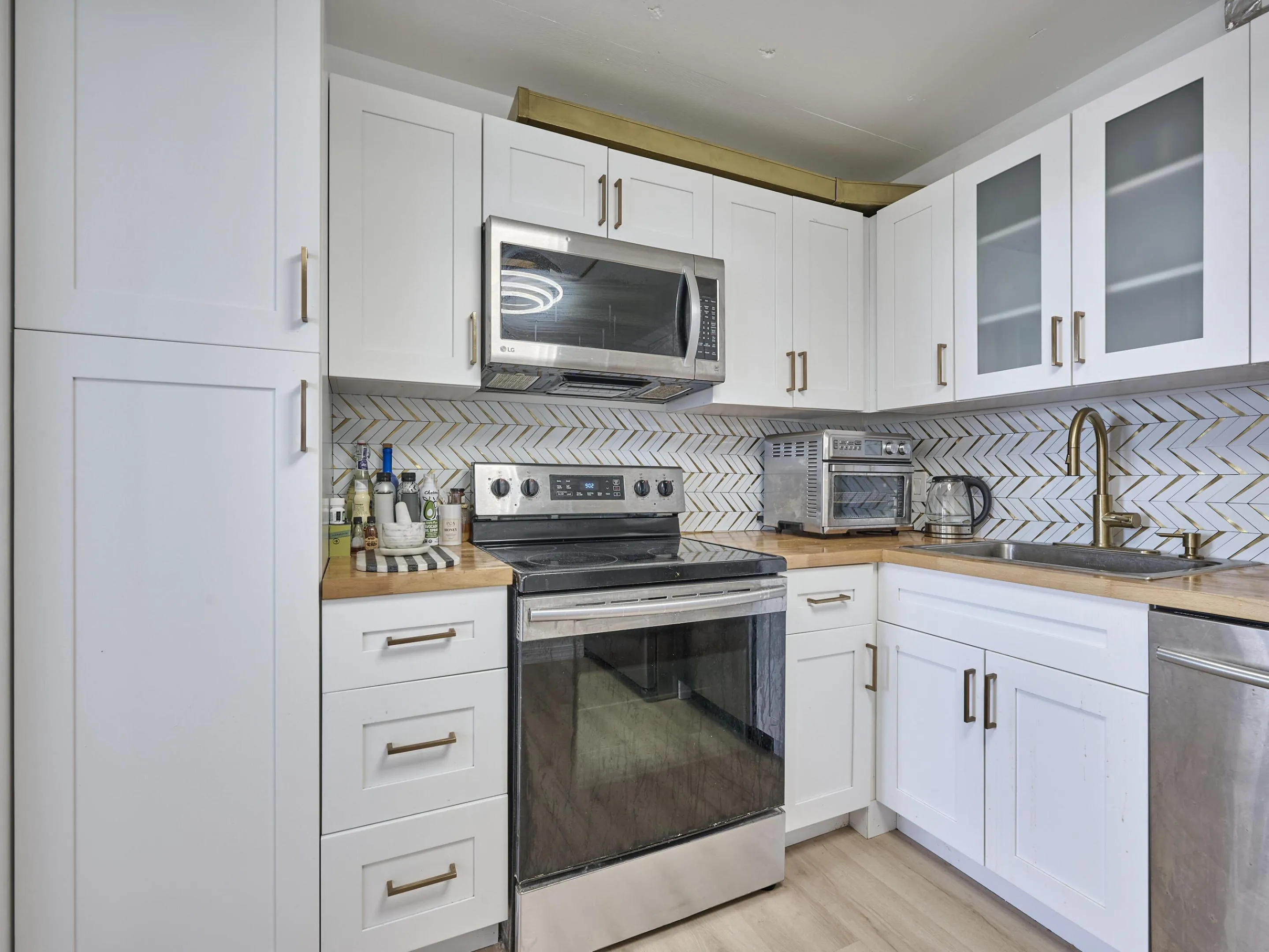 Kitchen | Updated with stainless steel appliances and modern finishes.