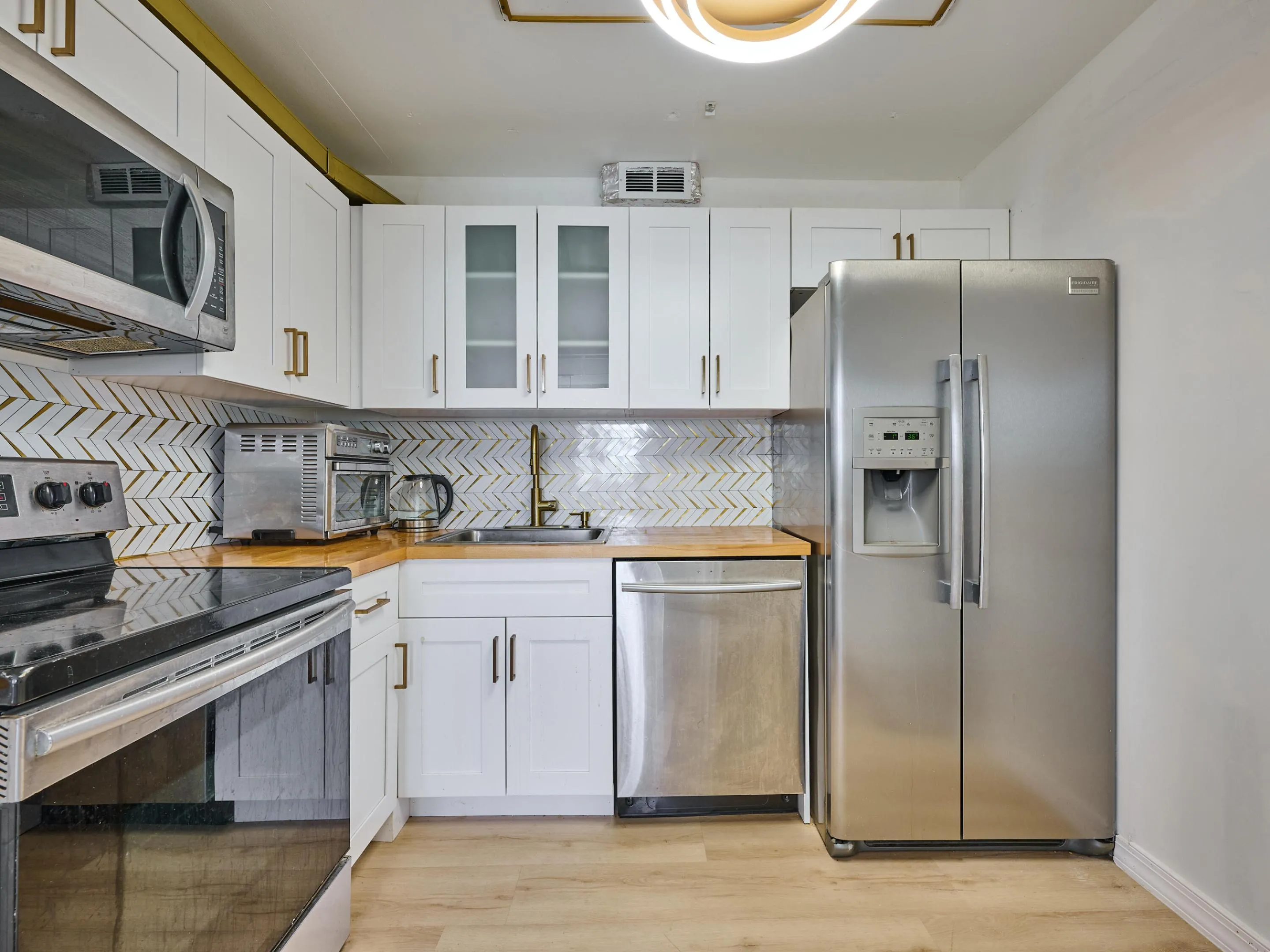 Kitchen | Updated with stainless steel appliances and modern finishes.