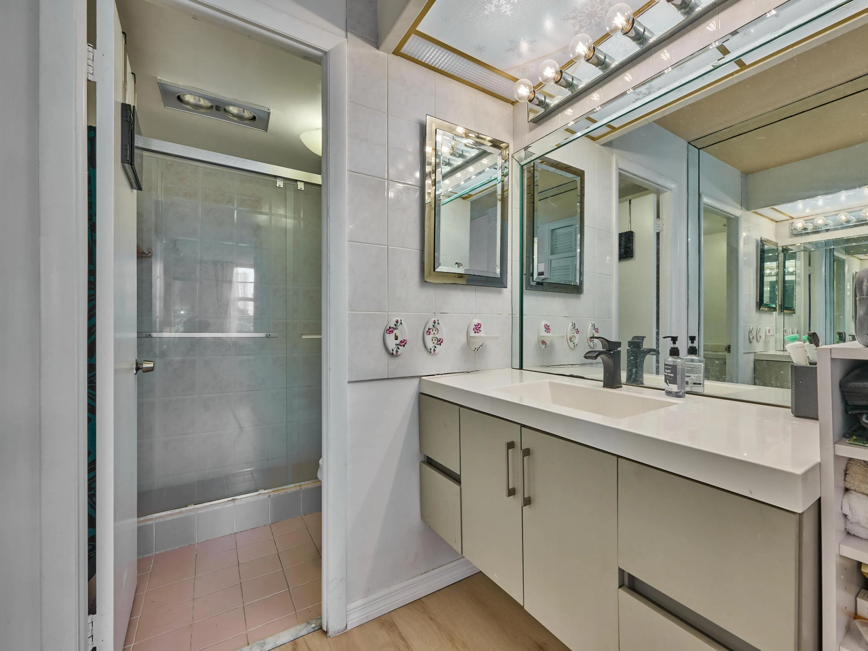 Primary Bathroom | Spacious vanity and glass-enclosed shower