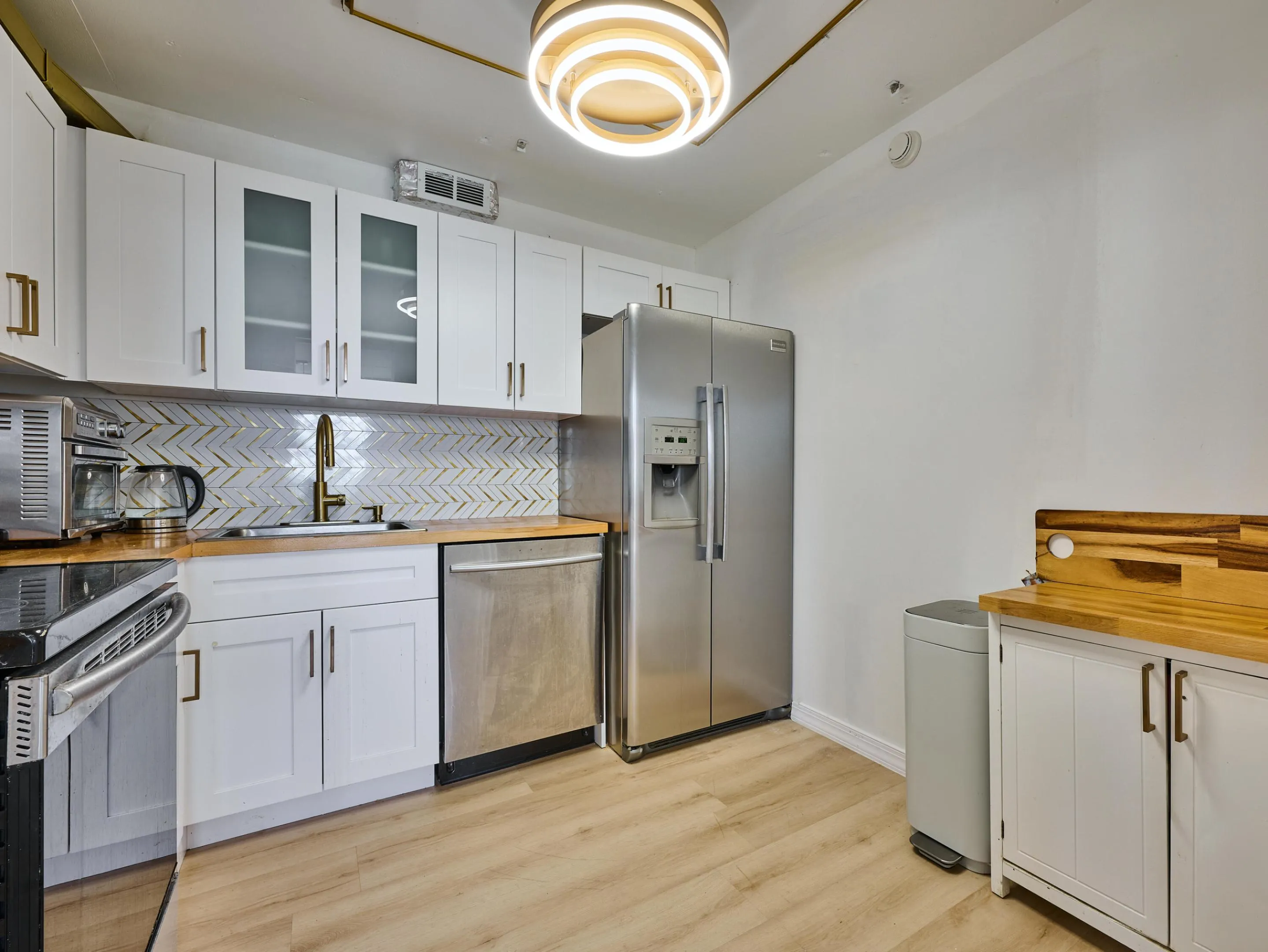 Kitchen | Updated with stainless steel appliances and modern finishes.