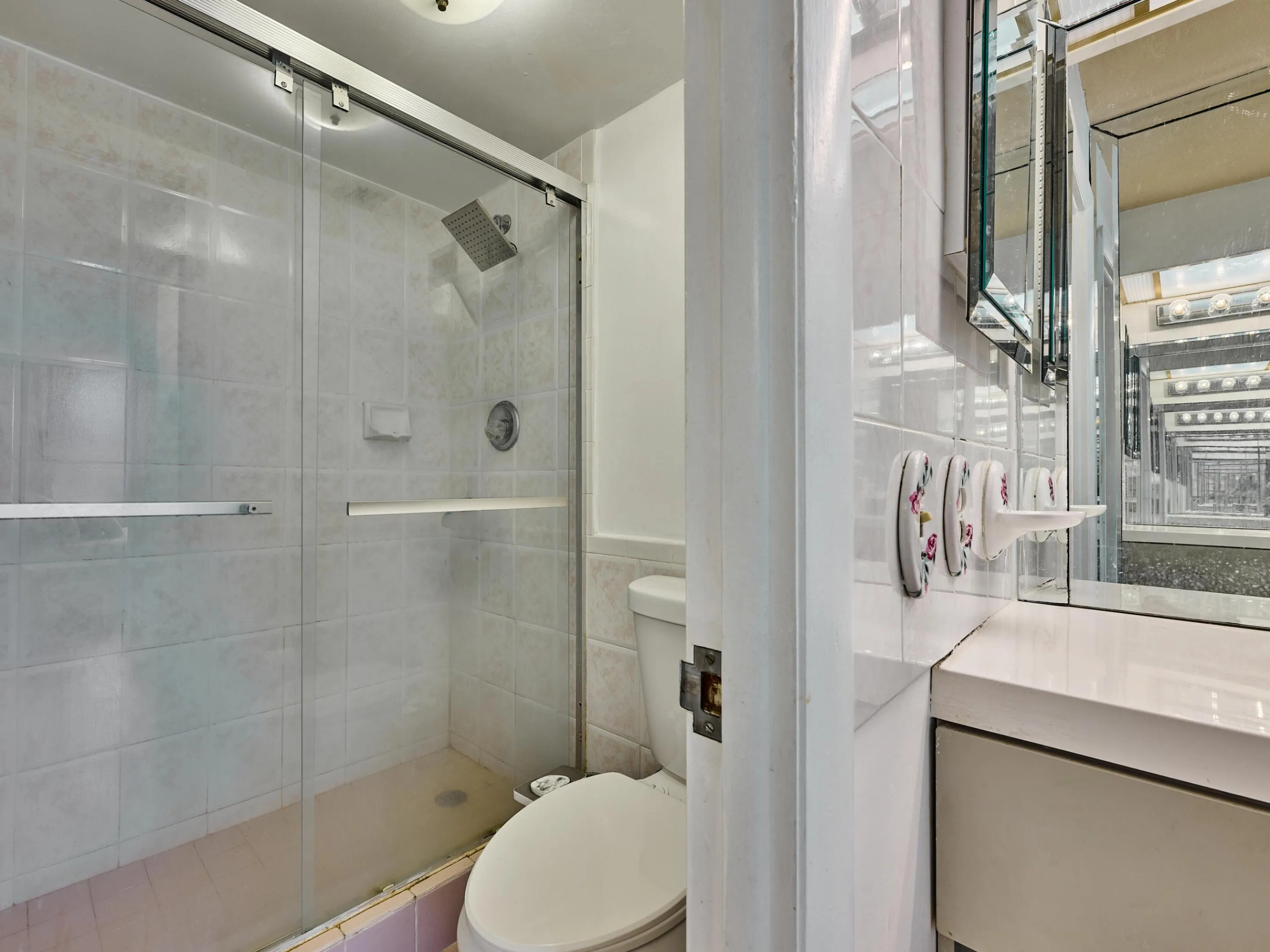 Primary Bathroom | Spacious vanity and glass-enclosed shower