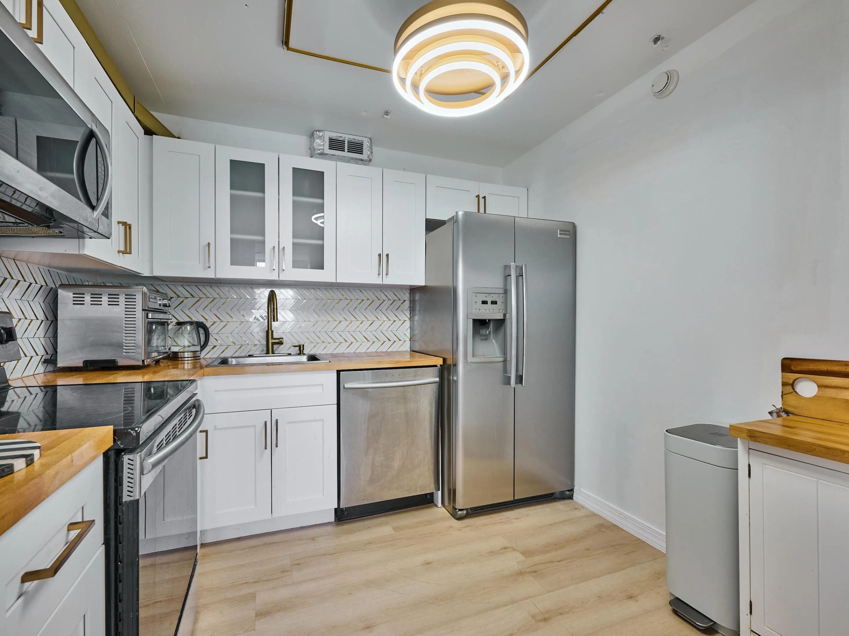 Kitchen | Updated with stainless steel appliances and modern finishes.