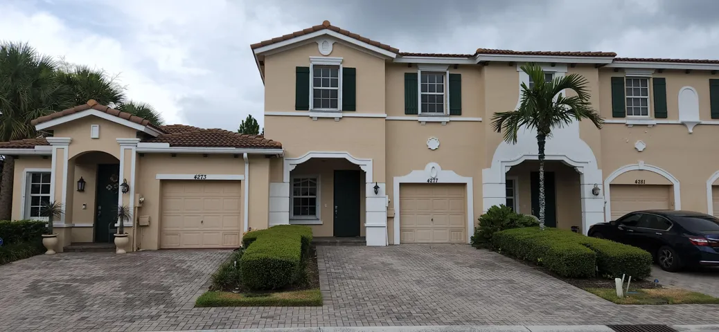Front with 1 car garage and parking for 2 cars